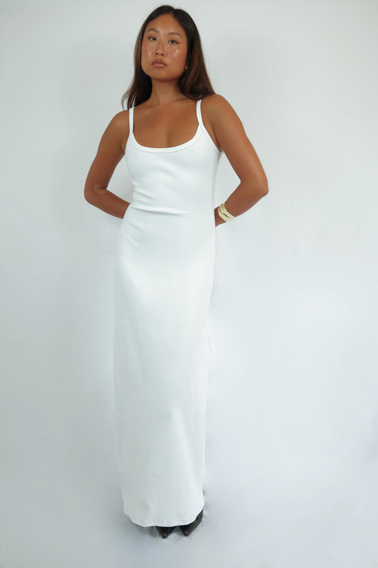 Front view of a white SESE maxi dress on a model.
