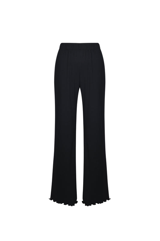 White ribbed flare pants, back view