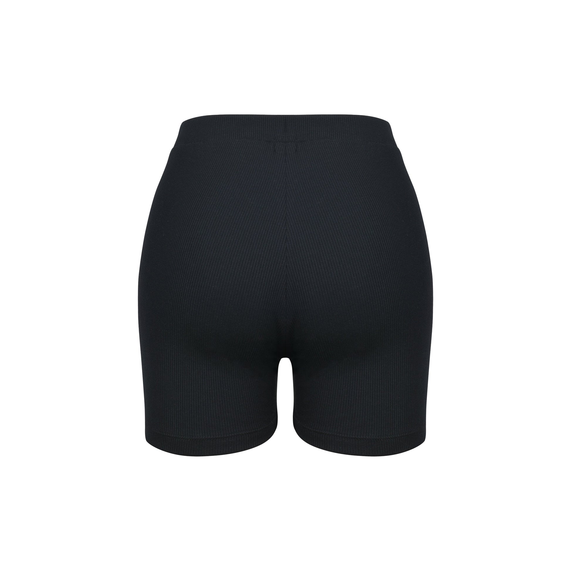 Woman wearing white cotton lounge shorts