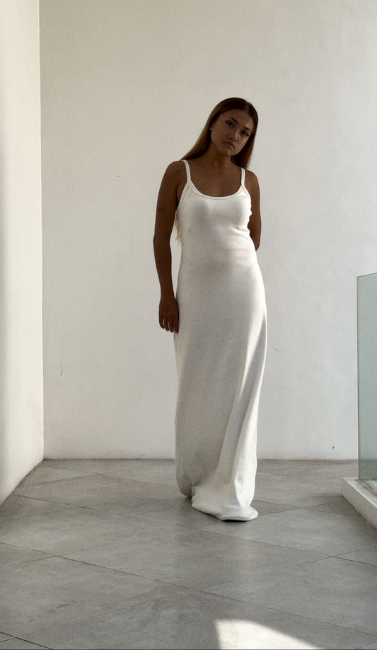 Model wearing a white SESE maxi dress.